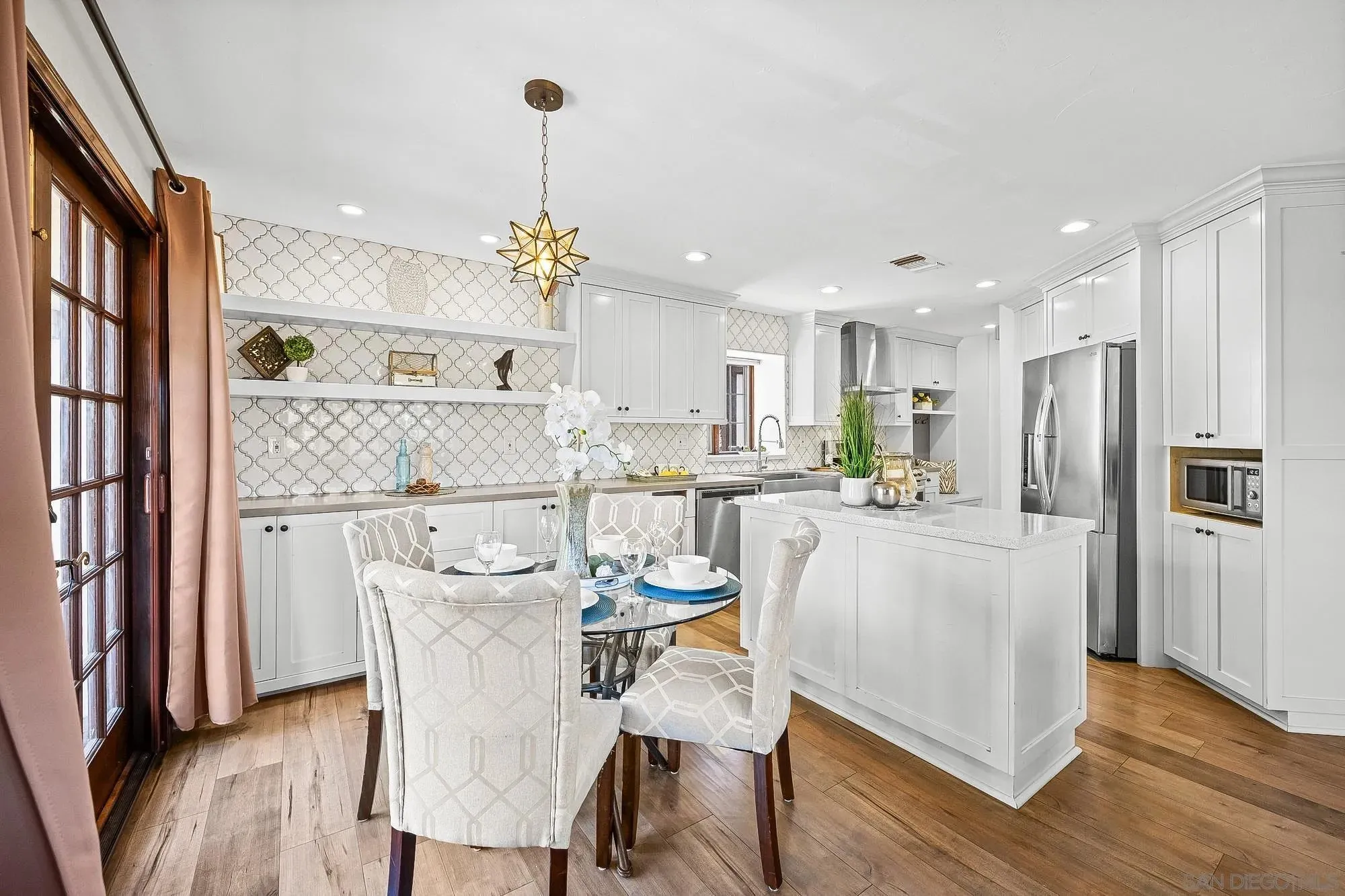 Dining Area with White Accents and Pendant Lighting