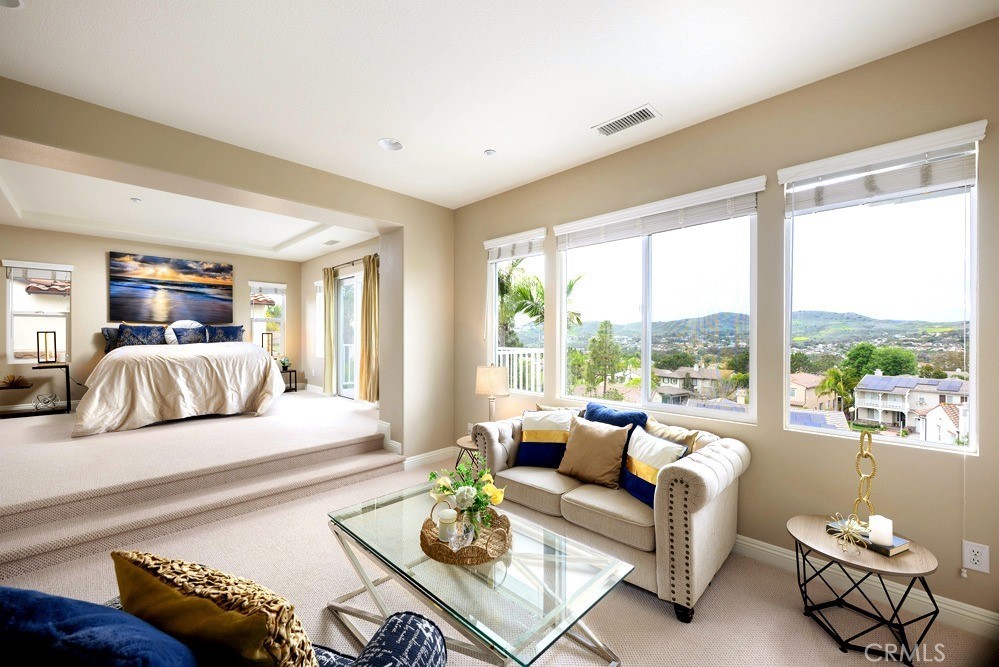 Primary Bedroom with Sitting Area and View