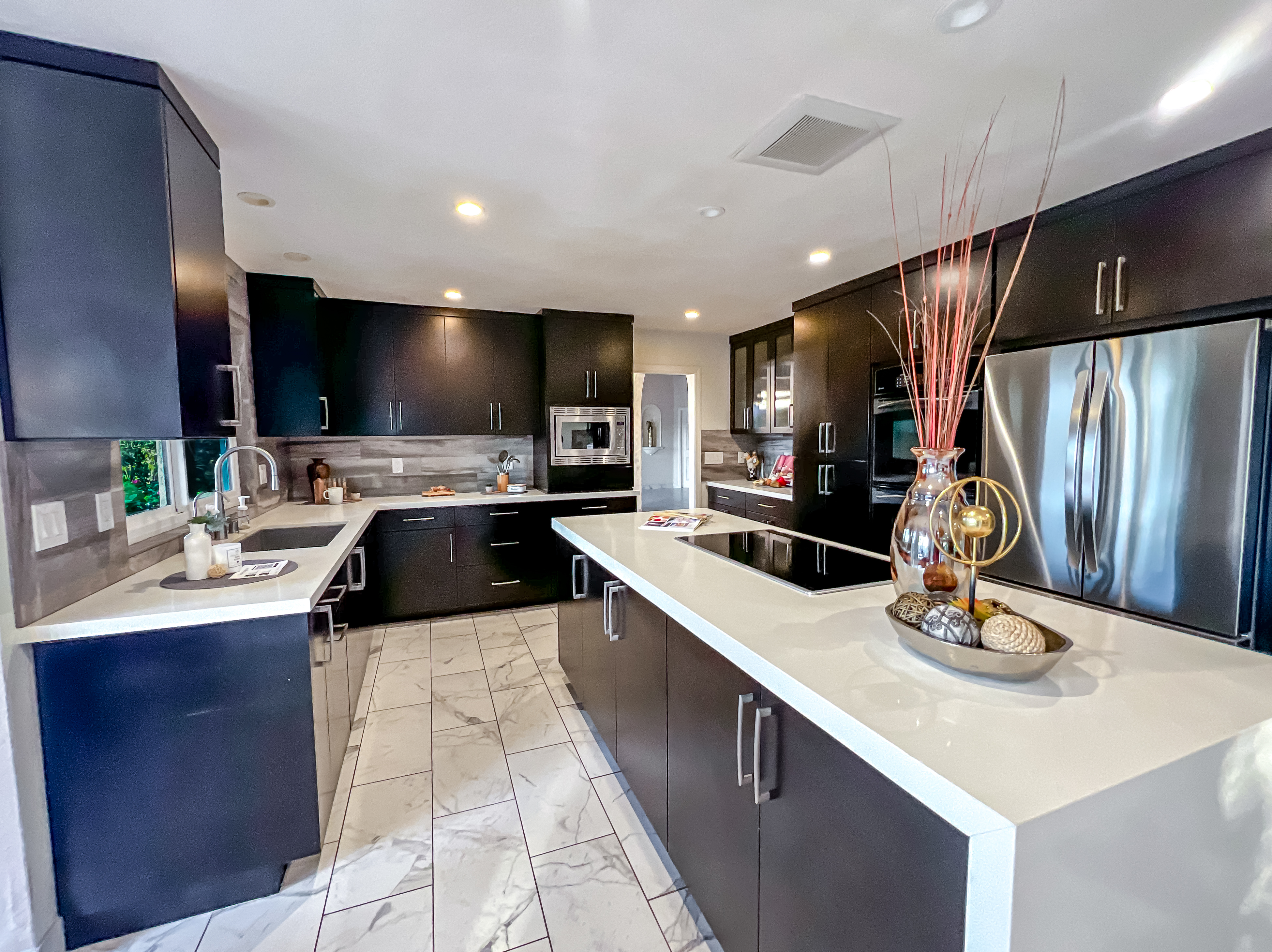After: Kitchen styled minimally to showcase high-contrast cabinetry