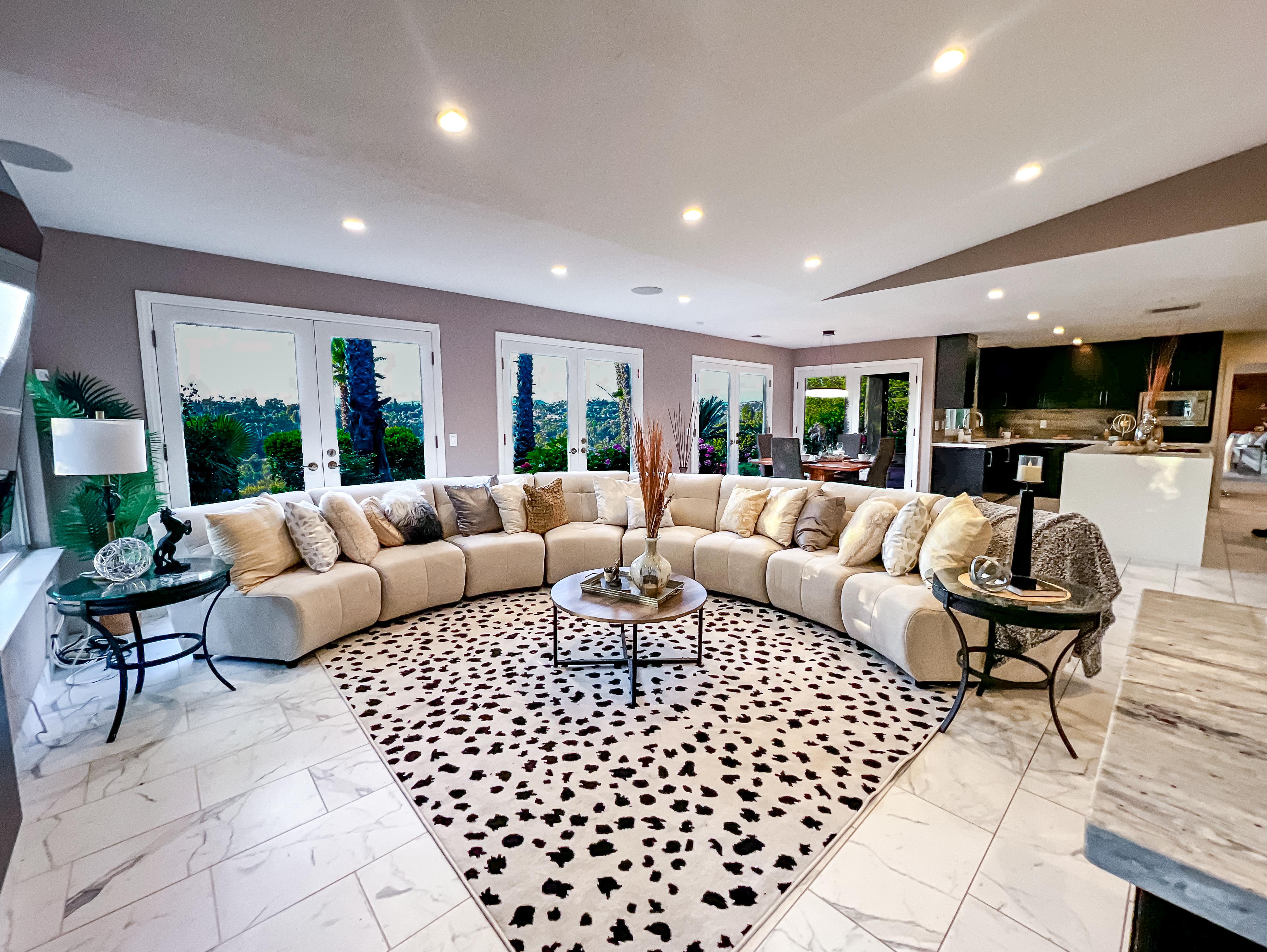 After: Family room grounded with rounded furniture layout