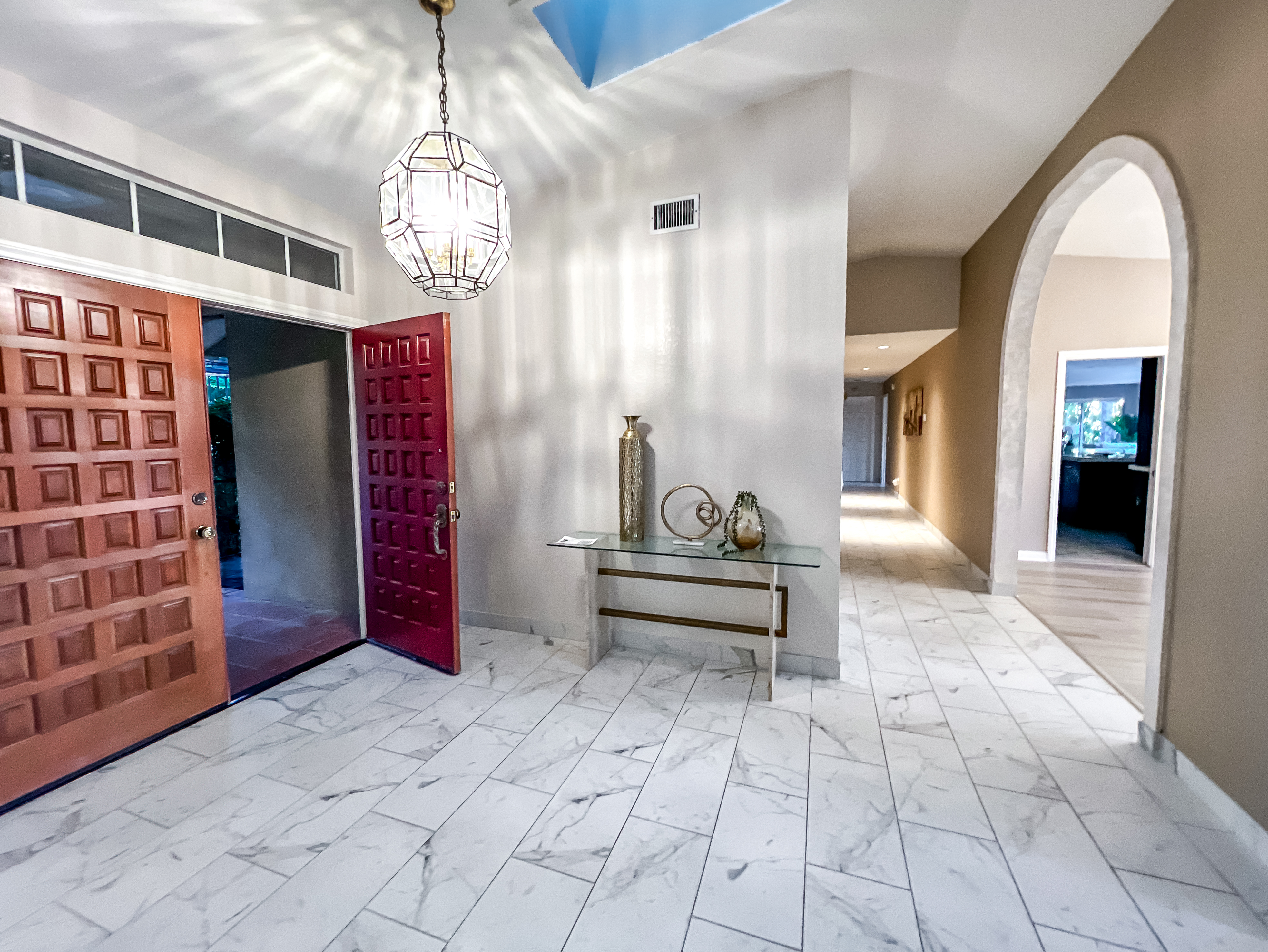 Monte Fuego Ranch entryway styled with metallic accents and vertical lines