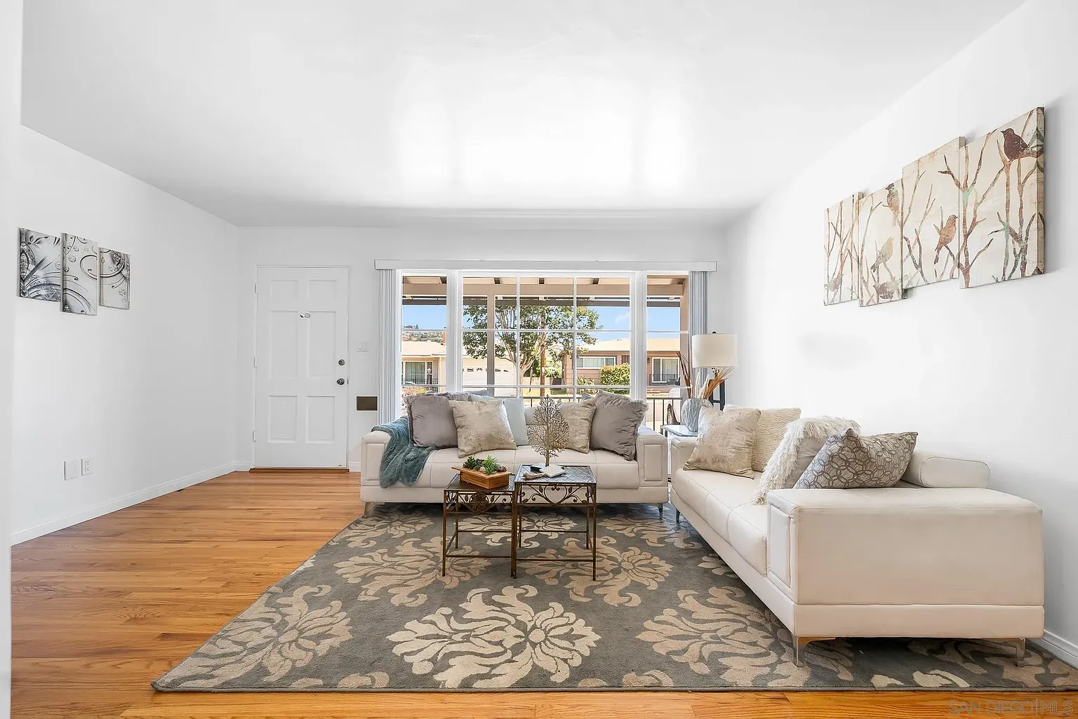 Rolando Bungalow living room with natural light and classic staging elements
