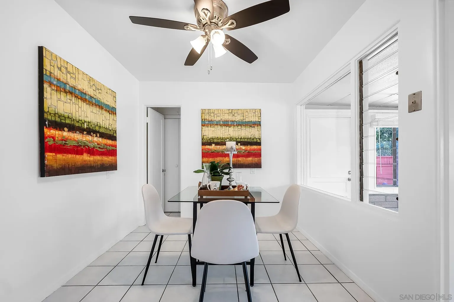 Bright Dining Area with Art Accents and White Flooring